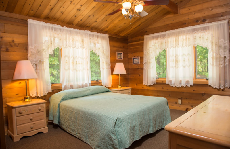 Cabin bedroom at Hiawatha Beach Resort.