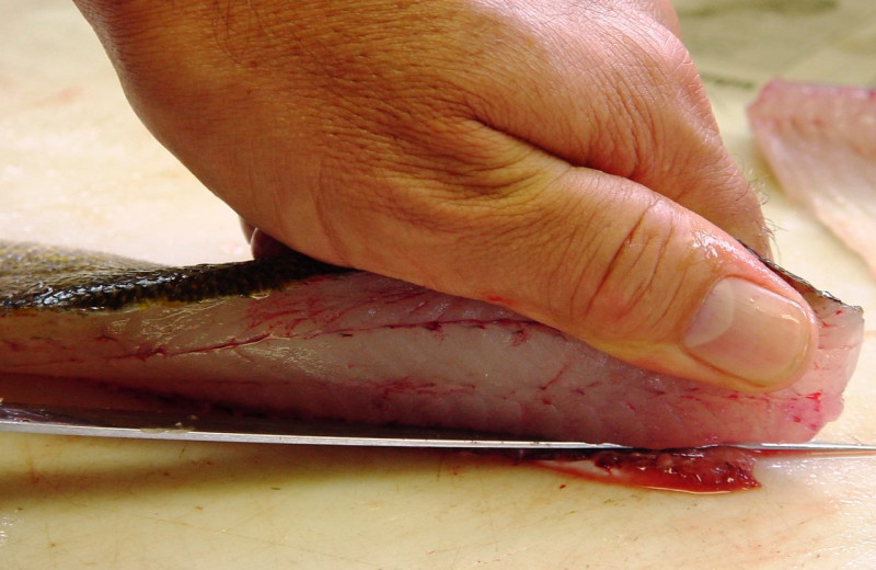 Cleaning fish at Eagle Wing Resort.