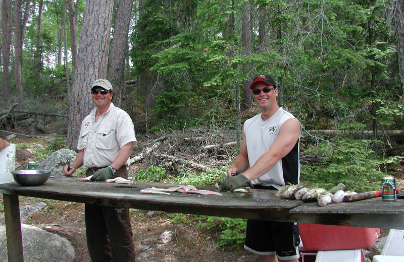 Cleaning fish at Maynard Lake Lodge and Outpost.