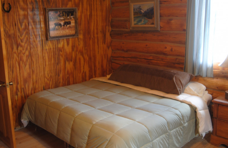 Cabin bedroom at Medicine Bow Lodge.