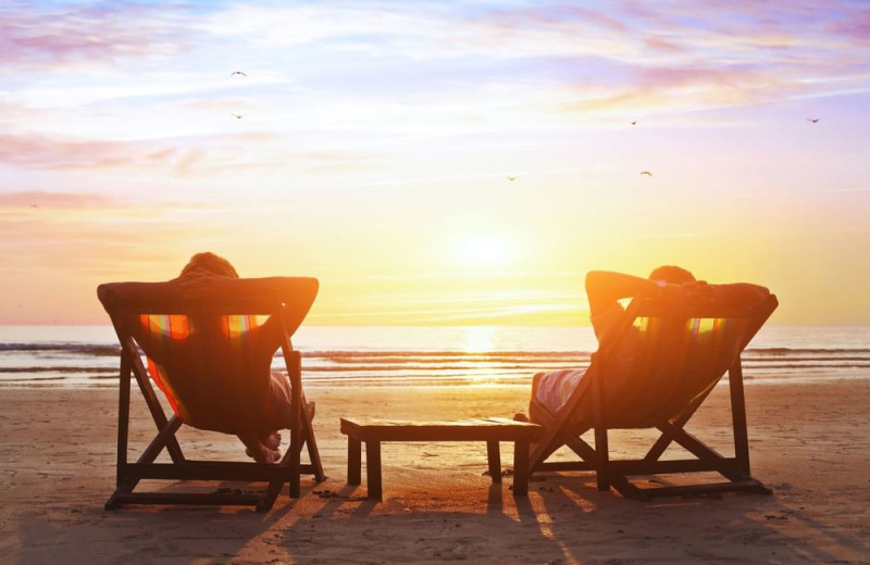 Couple on beach at Trianon Hotels and Trianon Properties, Inc.