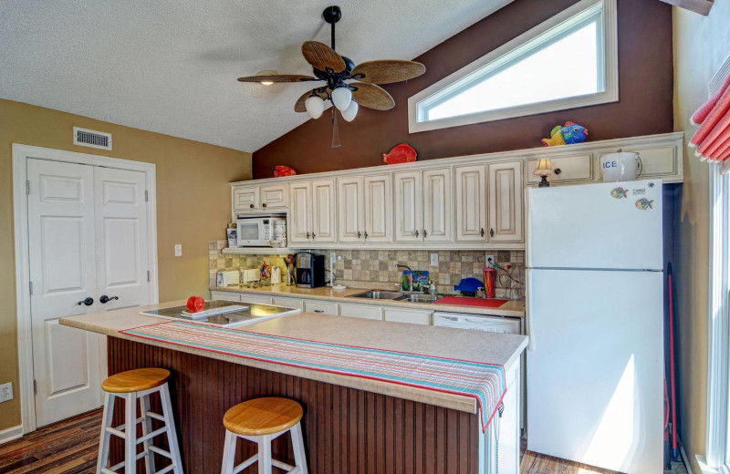 Vacation rental kitchen at Century 21 Action Inc.