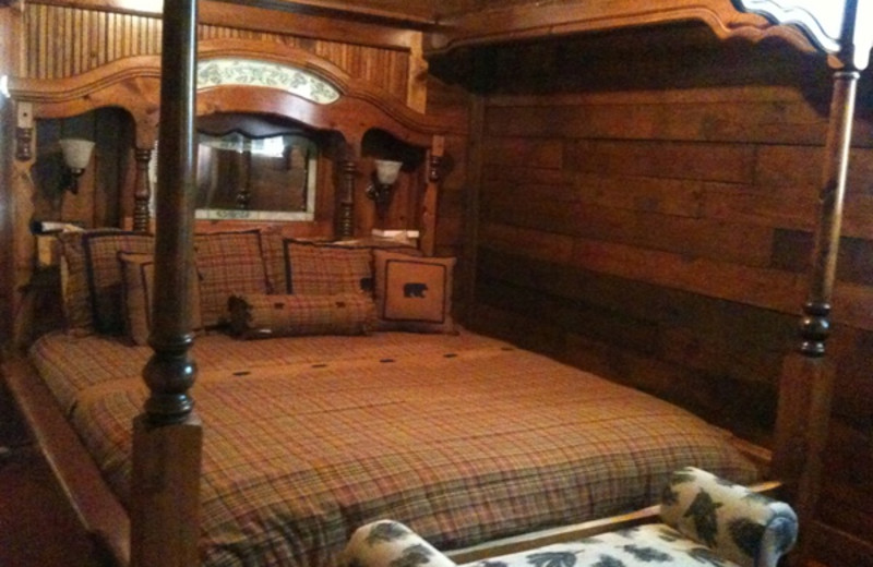 Cabin bedroom at Pine Lodge Cabins & Suites.