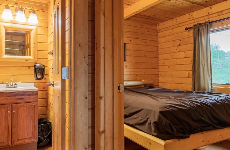 Cabin bedroom at Yogi Bear's Jellystone Park Clay's Resort.