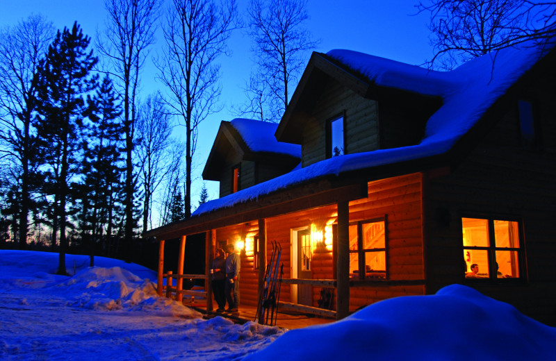 Snow-covered cabin at Timber Trail Lodge & Resort.
