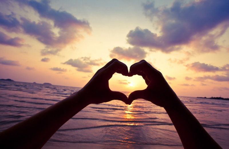 Hand heart on beach at Beacher's Lodge Oceanfront Suites.