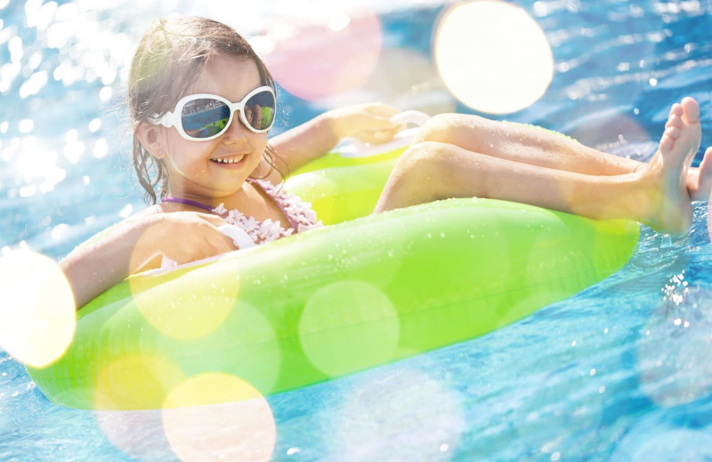 Kid swimming at Bender Realty Vacation Rentals.