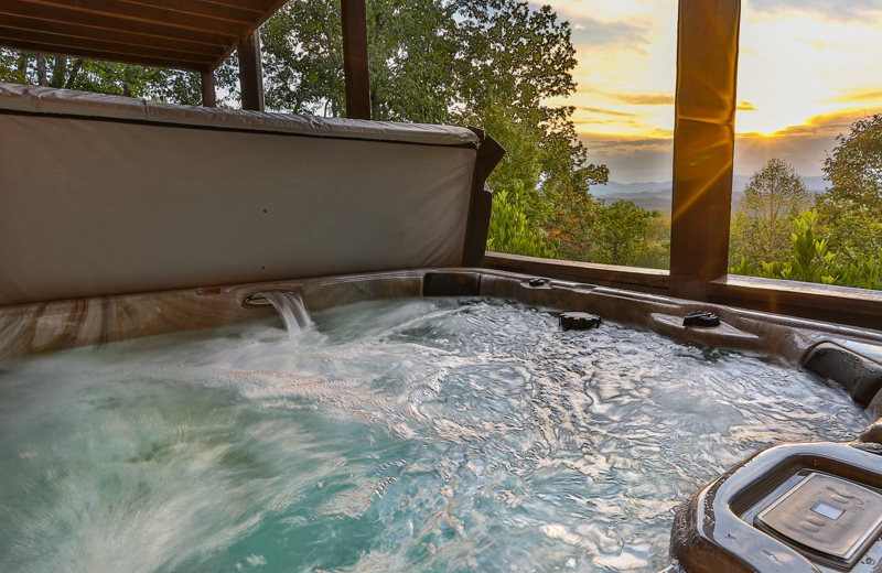 Cabin hot tub at Mountain Oasis Cabin Rentals.