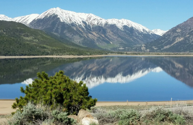 Twin Lakes lower lake is like glass first thing in the morning. Here on a busy day you might see a sailboat, a couple of kayakers and maybe some stand up boarders,,,wonderful!!