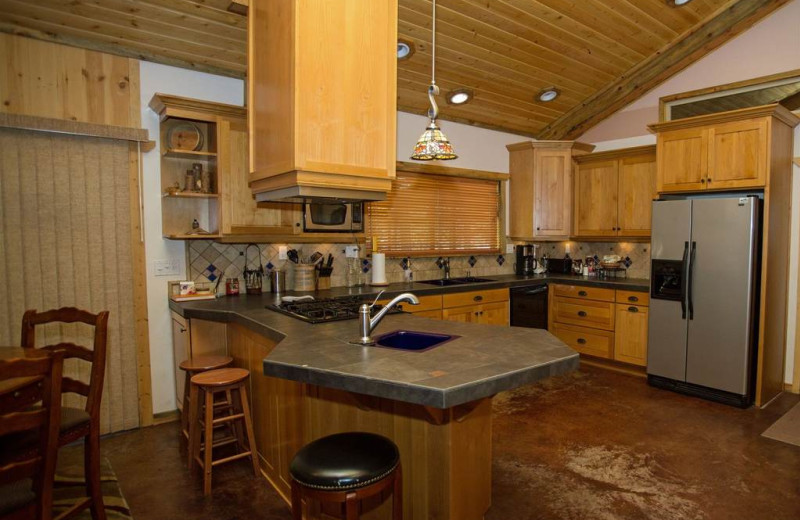 Spacious social kitchen opens to dining and living room. Propane range/oven. OOutdoor BBQ.