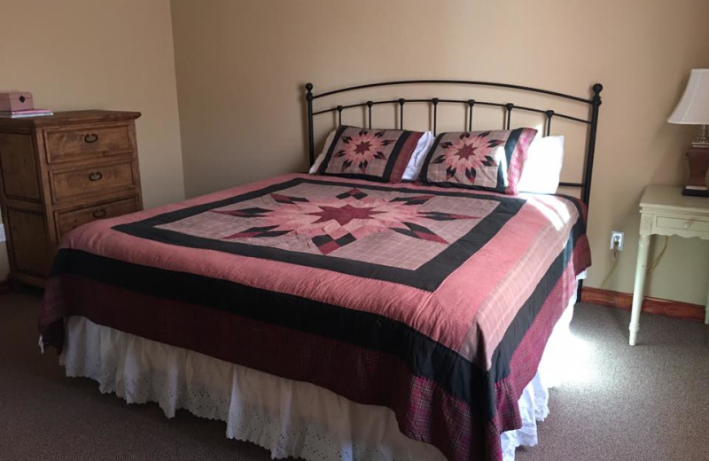 Cottage bedroom at Riverwood Resort.