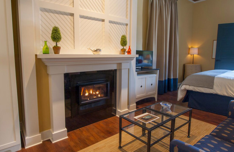 Guest room with fireplace at Inn at Diamond Cove.