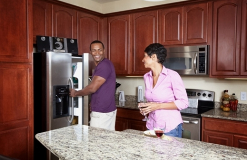 Couple in kitchen at Vista Cay Resort.