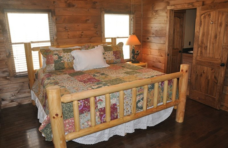 Cabin bedroom at Great Smokys Cabin Rentals.