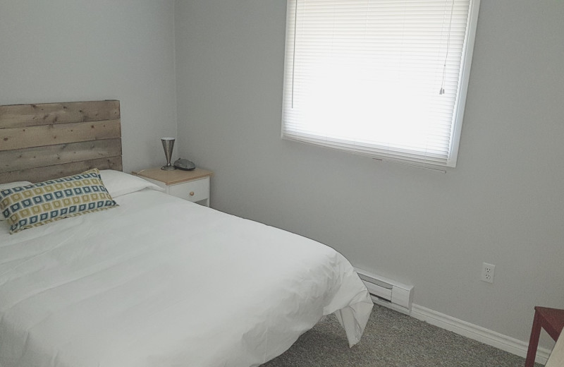 Cottage bedroom at Parkway Cottage Resort & Trading Post.