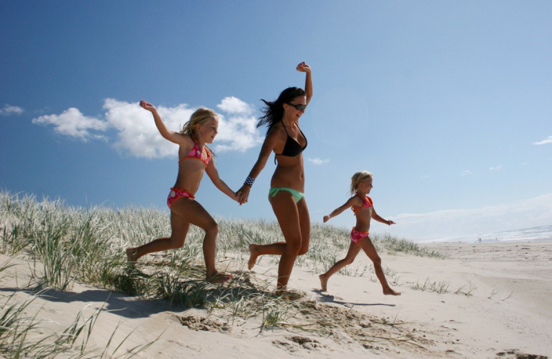 Family on beach at Kingfisher Vacations, Inc.