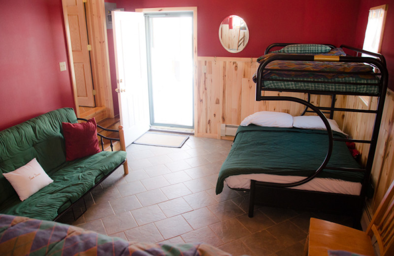 Cabin bedroom at Tri Lake Timbers Resort.