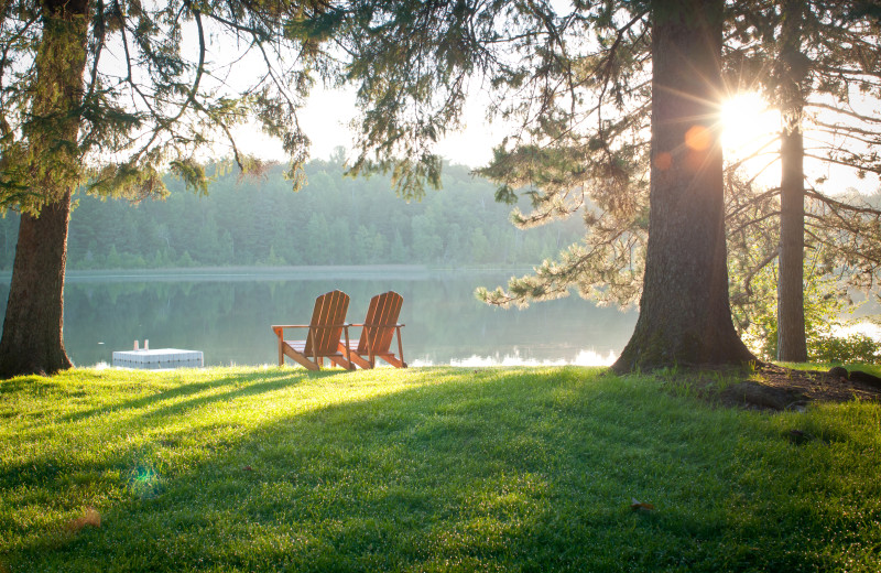 Relaxing in one of the many adirondack chairs overlooking Boot Lake is a perfect way to watch the sunrise or sunset. 