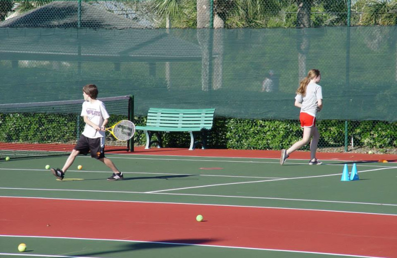 Playing tennis at St. Augustine Ocean & Racquet Resort.