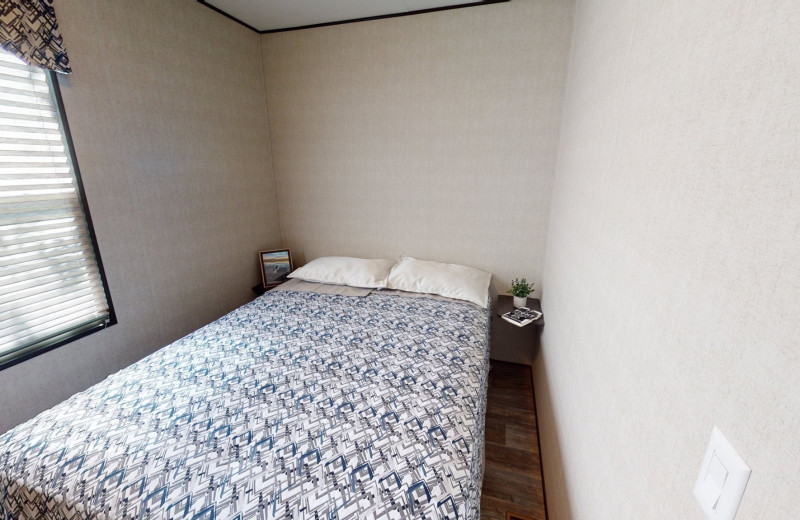 Cottage bedroom at Great Blue Resorts- Shamrock Bay Resort.