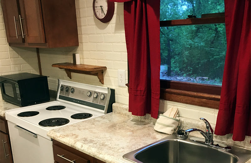 Cabin kitchen at Golden Arrow Resort.