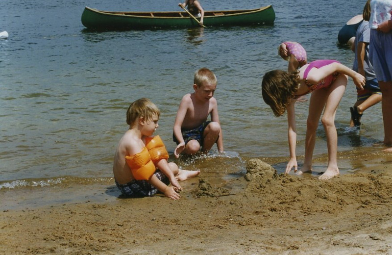 Kids playing on the beach at All-Season Cottage Rentals.