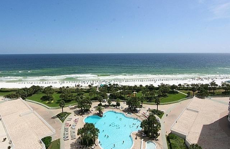 Outdoor pool and beach at Compass Resorts.