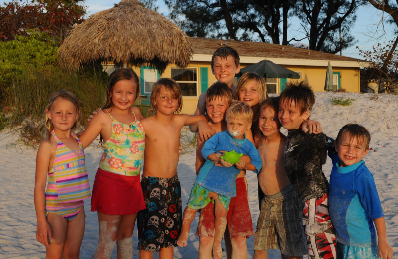 Family on beach at Anna Maria Island Inn.