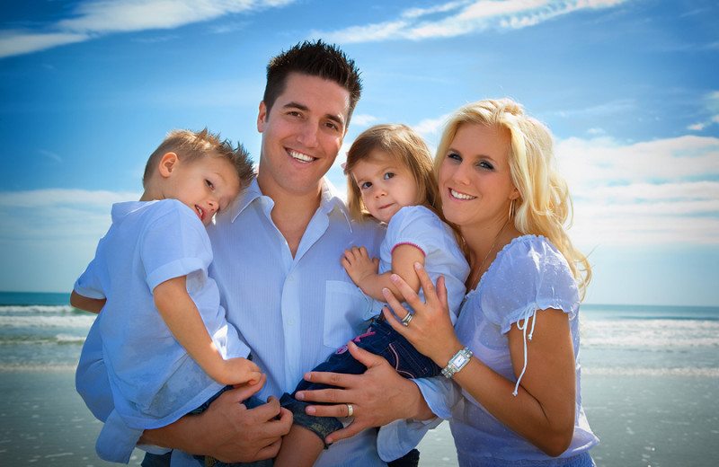 Family on the beach at Boca Ciega Resort.