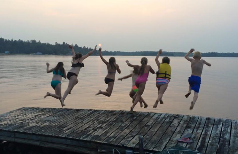 Jumping in lake at Snyder's Idlewild Resort.