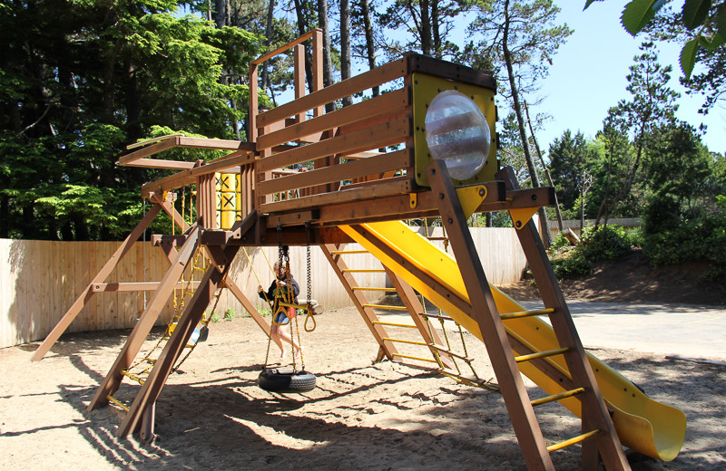 Vacation rental kid's playground at Beachfront Vacation Rentals.