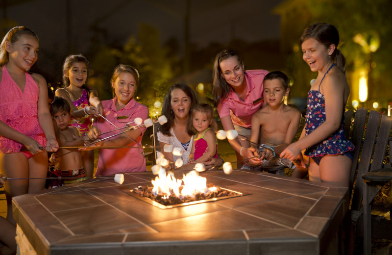 Family by fire pit at The Woodlands Resort and Conference Center.