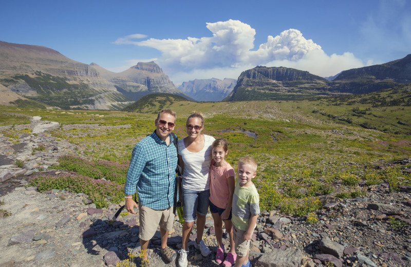 Family hiking in Glacier National Park near Going to the Sun Inn and Suites.