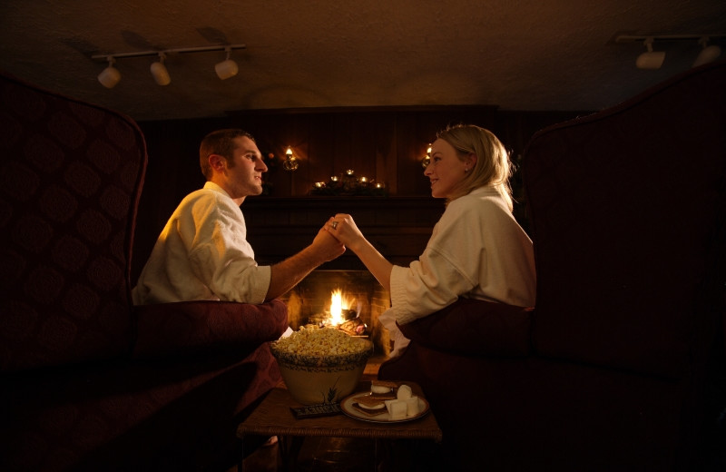 Couple by the fire at HideAway Country Inn.