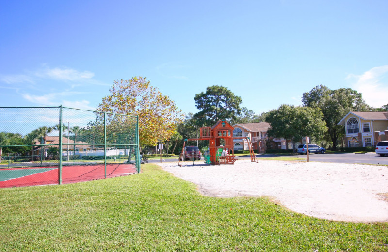 Rental tennis court and playground at Favorite Vacation Homes.