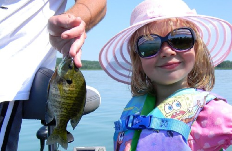 Kid With Fish at Janetski's Big Chetac Resort