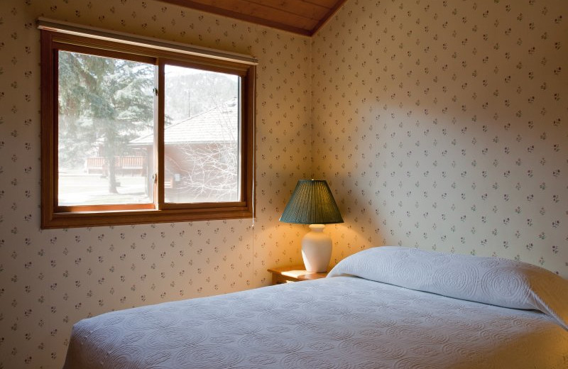 Cabin bedroom at Sylvan Dale Guest Ranch.