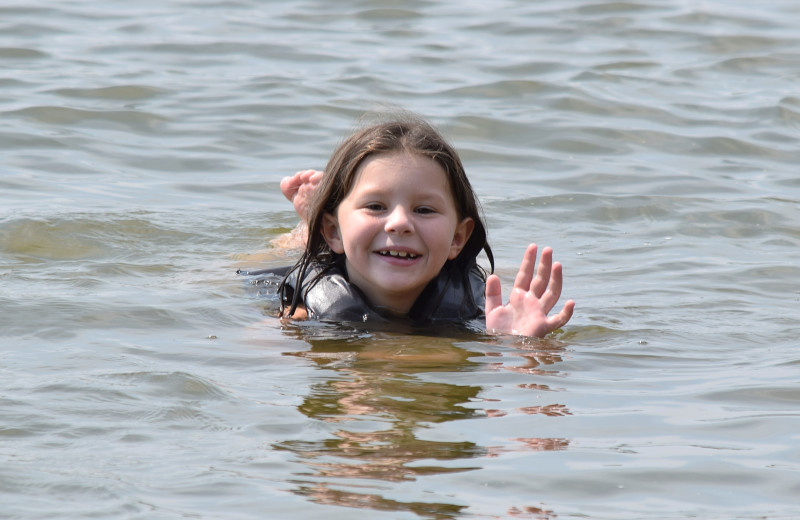 Kid swimming at Canary Beach Resort.