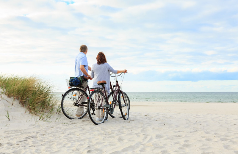 Couple on beach at Vacation Time of Hilton Head Island.