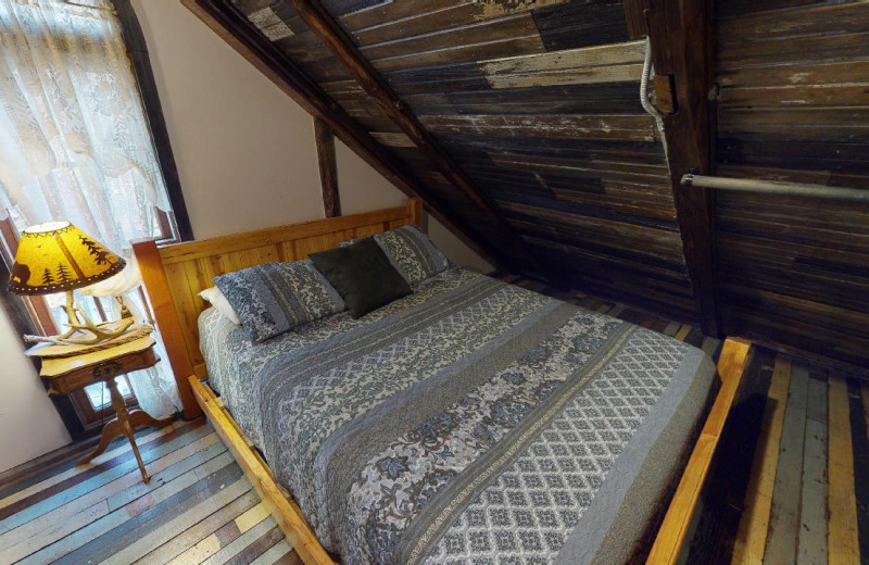 Cabin bedroom at 1st Choice Cabin Rentals.