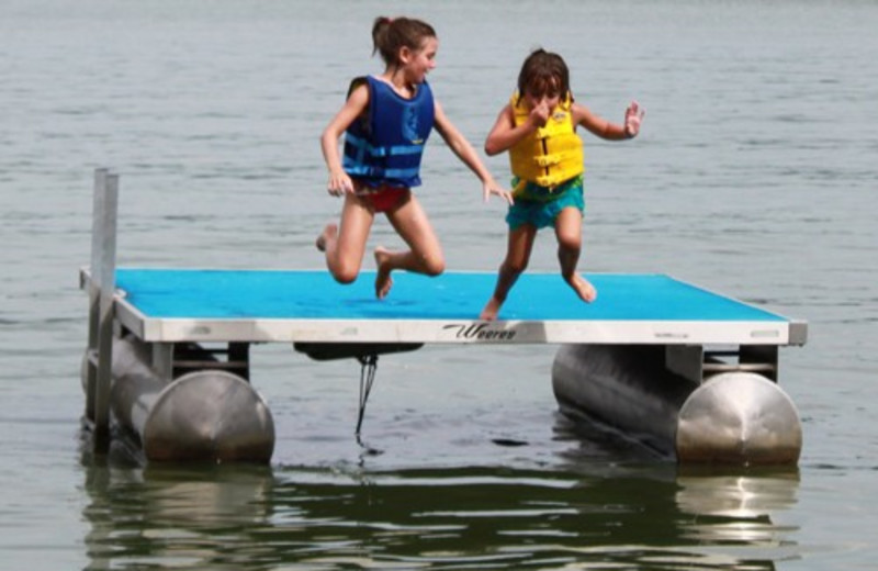 Kids Playing At The Lake at Janetski's Big Chetac Resort 