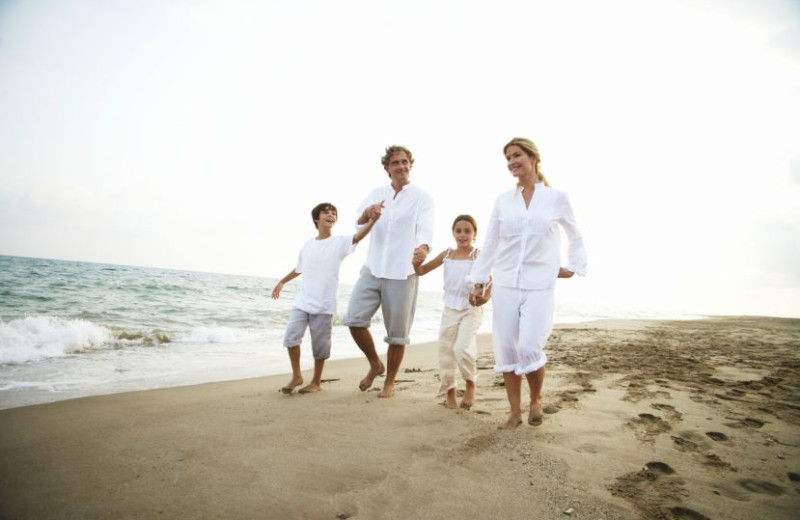 Family on beach at Litchfield Real Estate.