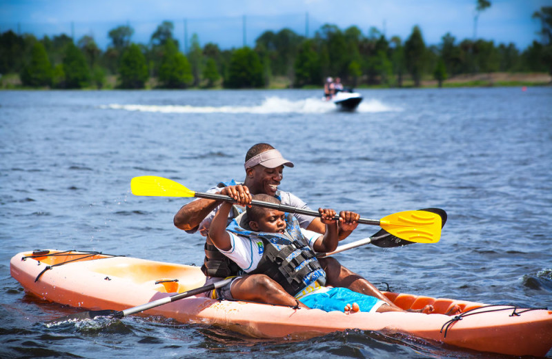 Family kayaking at Holiday Inn Club Vacations at Orange Lake Resort.