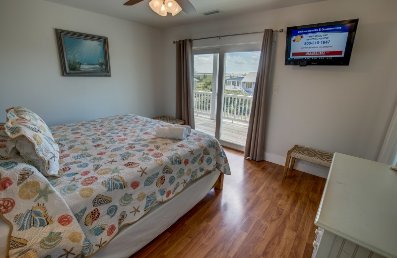 Rental bedroom at Sandbridge Blue Vacation Rentals.