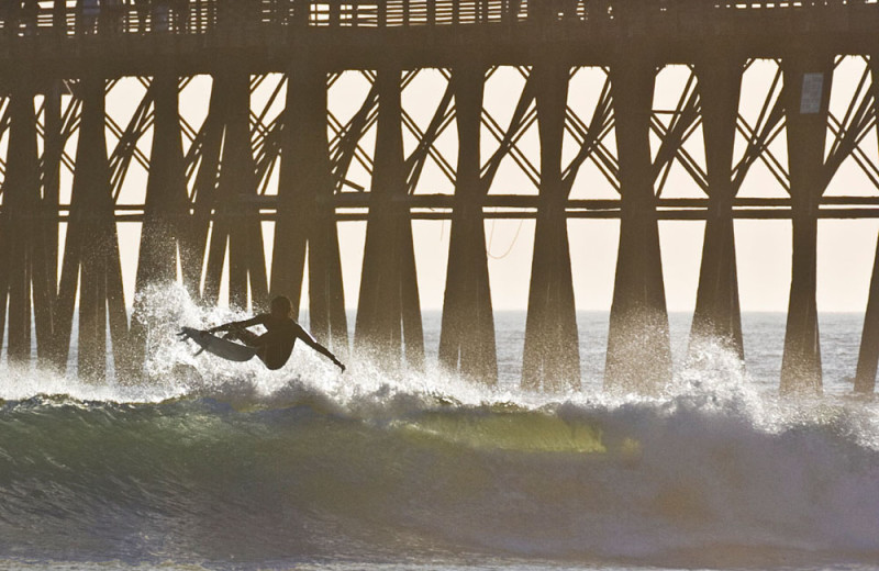 Surfing at the Oceanside Pier in Oceanside, California