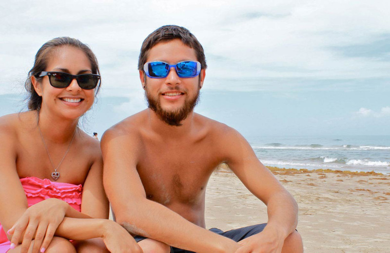 Couple on beach at Padre Getaways.