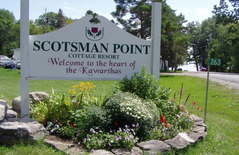 Welcome sign at Scotsman Point Cottage Resort. 