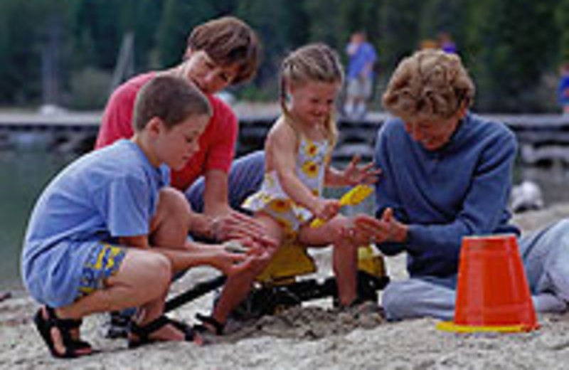 Kids playing in the sand at A-Ga-Ming Golf Resort.