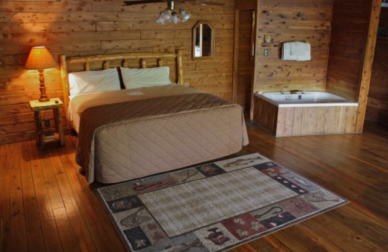 Cabin bedroom at Lindsey's Rainbow Resort.