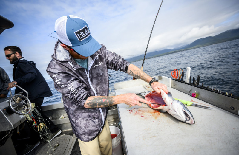 Cleaning fish at Elfin Cove Resort.